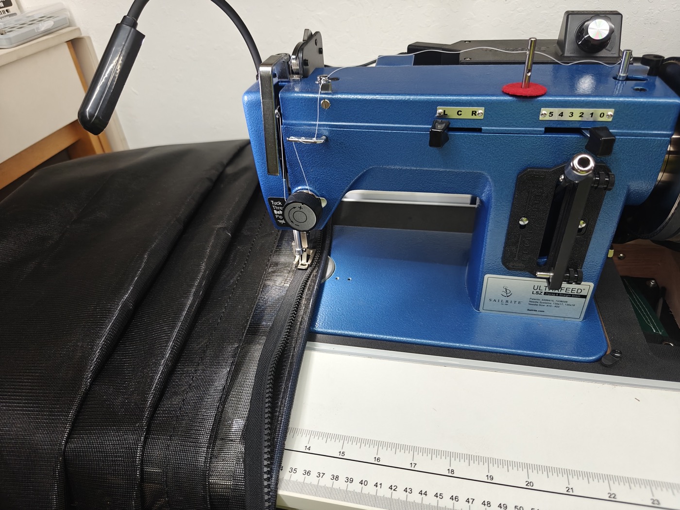 Sailrite Ultrafeed LSZ sewing machine stitching a heavy-duty zippered case